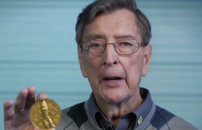 Photo: Murray Dowey Holding Olympic Gold Medal