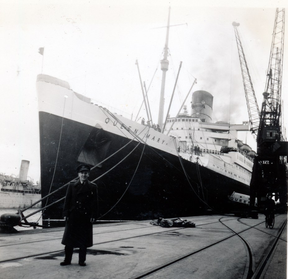Photo: Flyer Reg Schroeter Standing in Front of Queen Mary 
