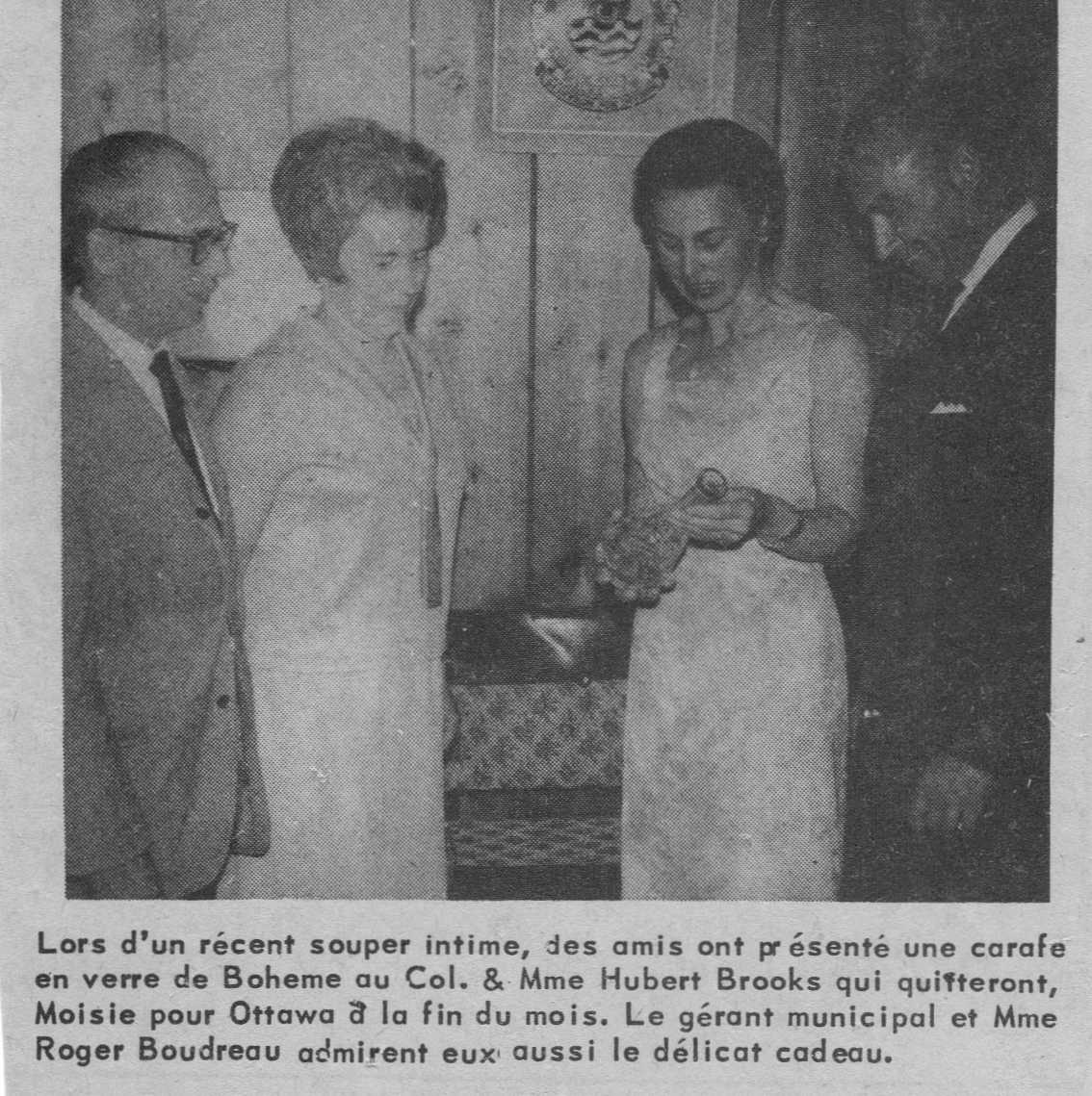 Photo: Newspaper photo of Hubert & Birthe Brooks receiving departure gift in Sept–Iles  