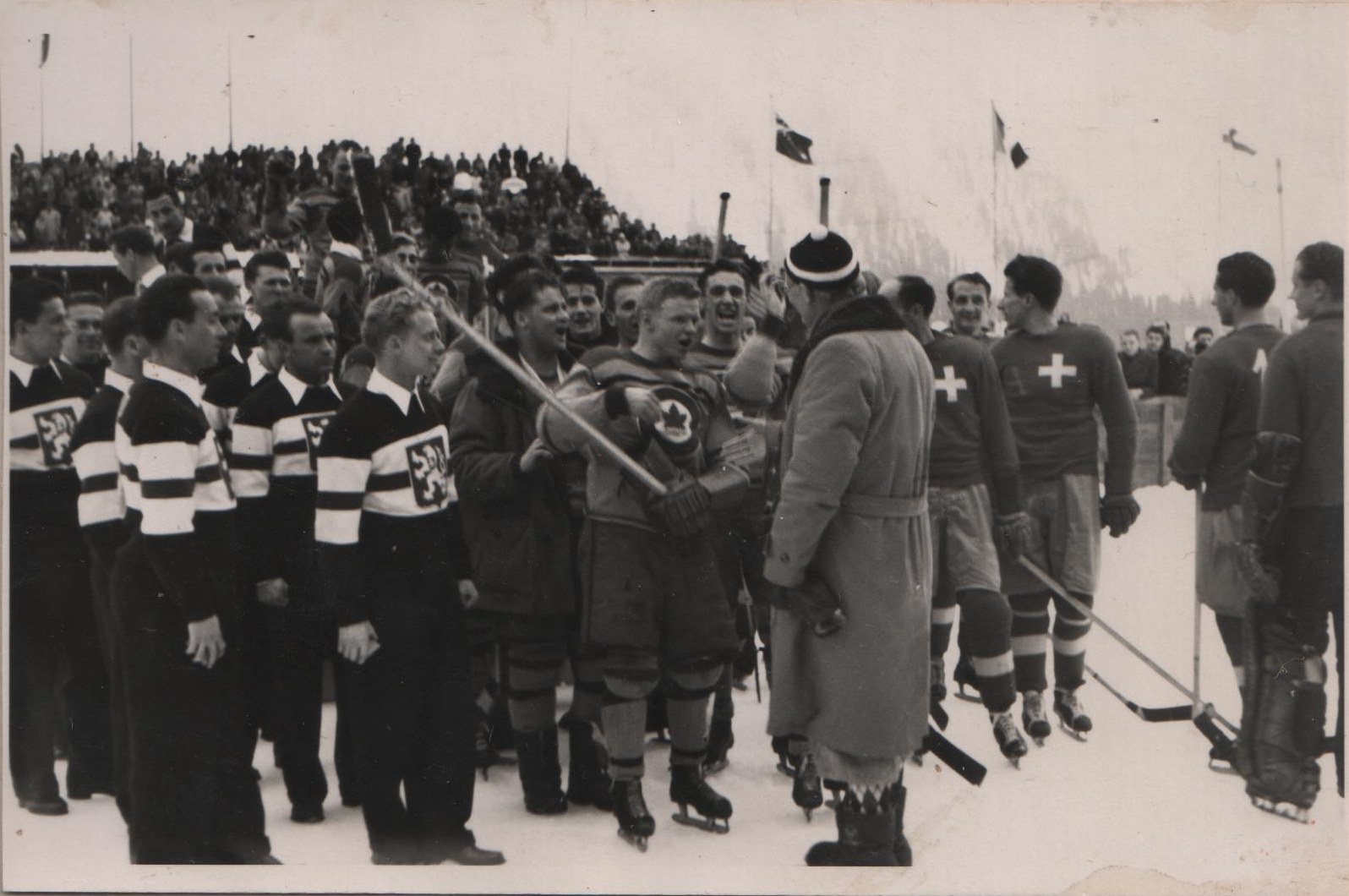 Photo: Gold, Silver, Bronze 1948 Olympic Hockey Team Winners Mix after Medal Ceremonies